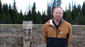  Kiel Wilkie in front of the dam